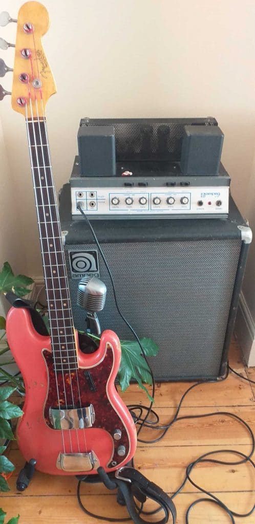 vintage ampeg bass amp and fender bass guitar